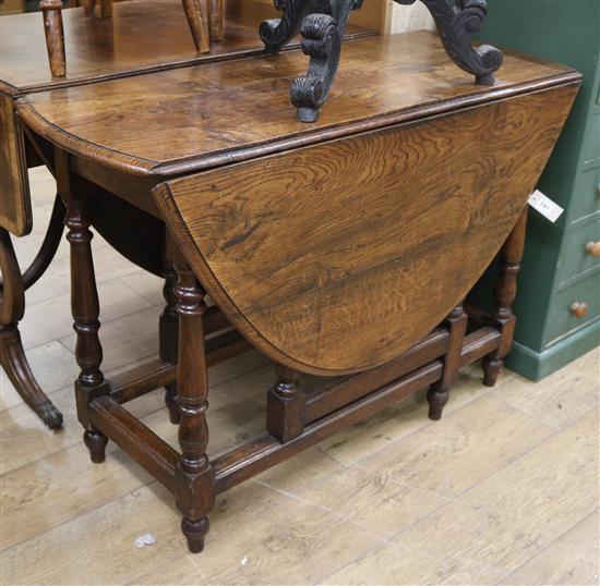 An elm top gateleg table W.105cm